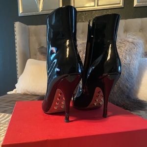 Beautiful Valentino booties with signature grommets.